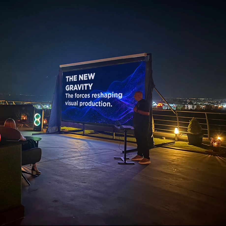 Nighttime rooftop screening with a presentation on visual production