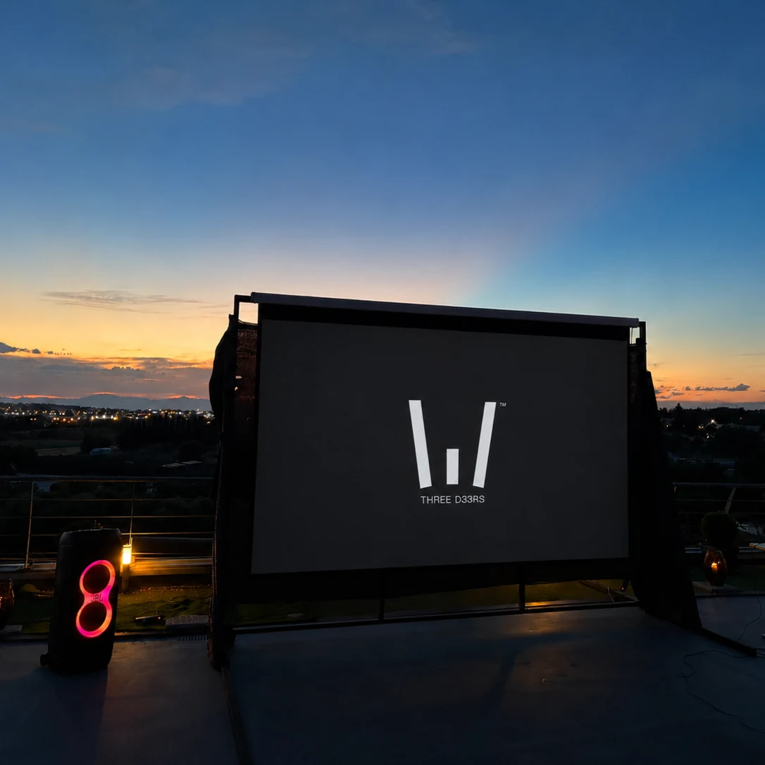 Presentation screen on the studio rooftop against the evening sky