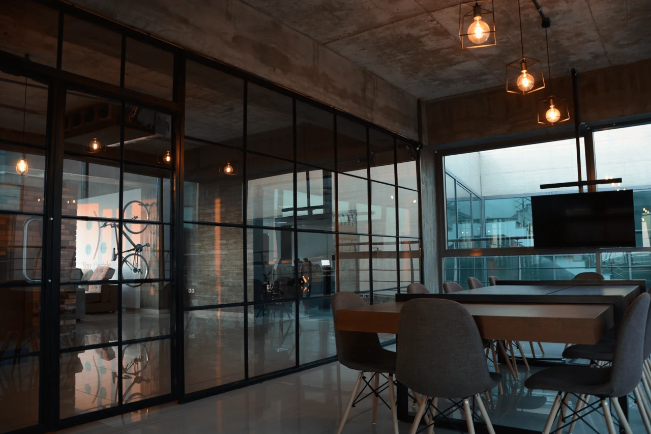 Glass-walled meeting and work areas inside the THREEDEERS studio